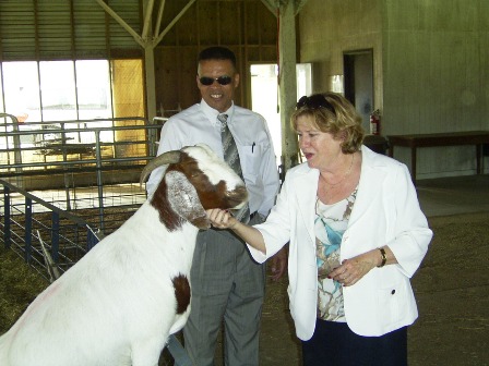Barbara Leach, Dr. Ralph Noble, visit goat