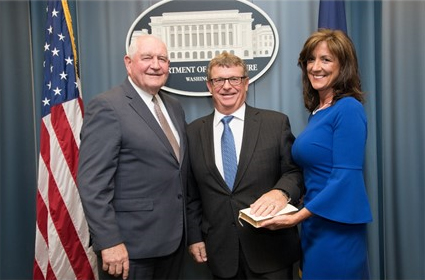 Agriculture Secretary Sonny Perdue with the newly sworn-in administrator for USDA's Risk Management Agency, Martin Barbre (center), and his wife, Gayla. Washington, D.C., April 30, 2018