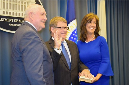 Agriculture Secretary Sonny Perdue with the newly sworn-in administrator for USDA's Risk Management Agency, Martin Barbre (center), and his wife, Gayla. Washington, D.C., April 30, 2018